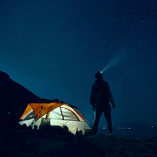 camper looking up at the stars